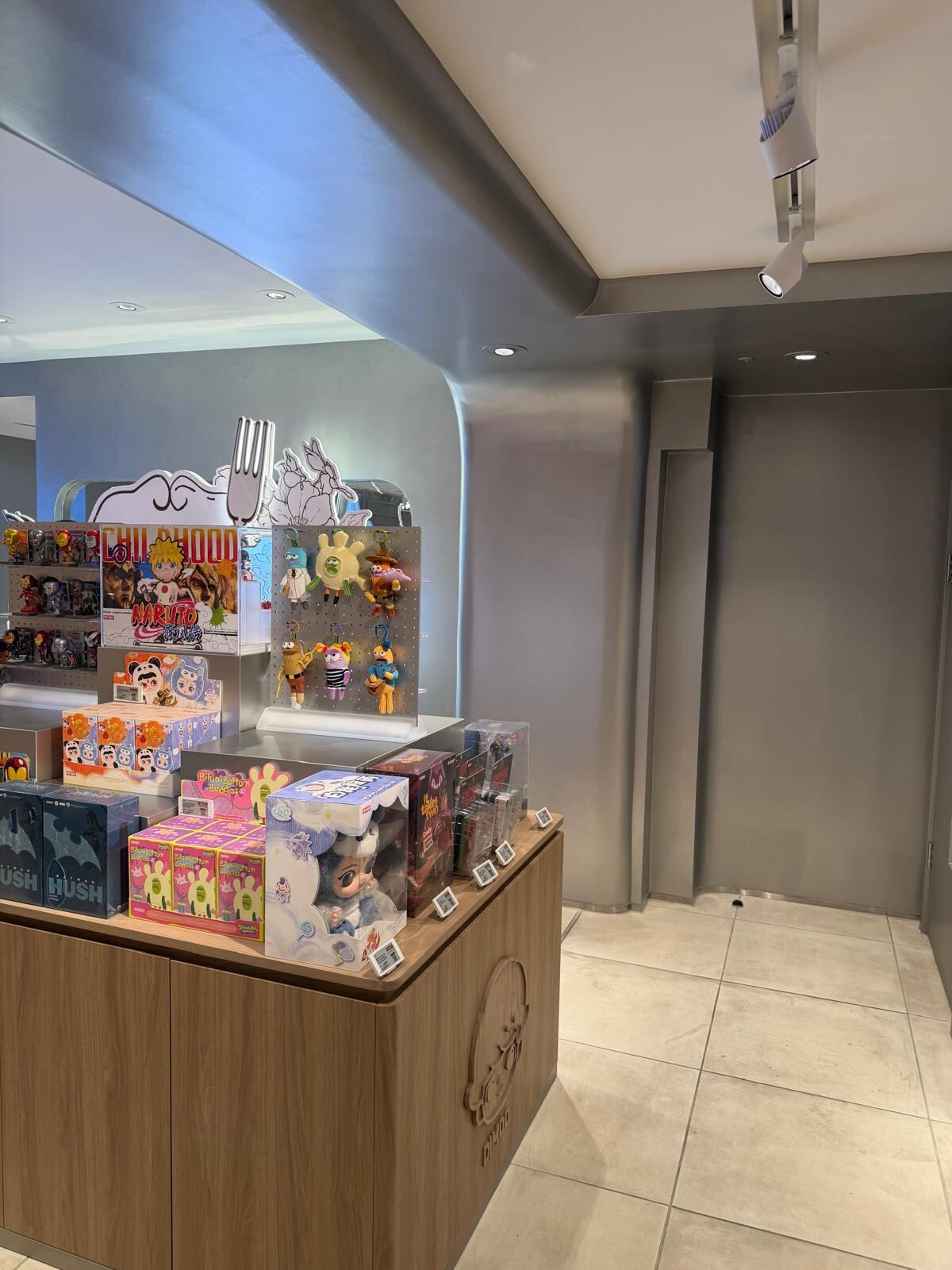 Pop Mart Charing Cross — finished display island with branded plinth
