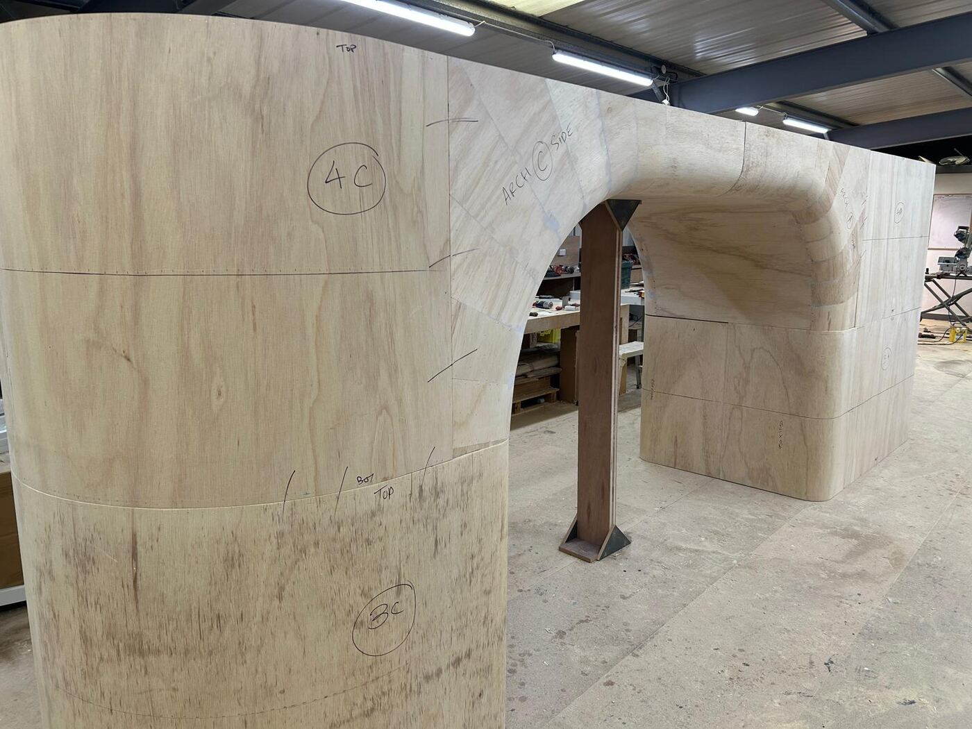 Pop Mart Charing Cross — archway and column with set-out marks ready for cladding