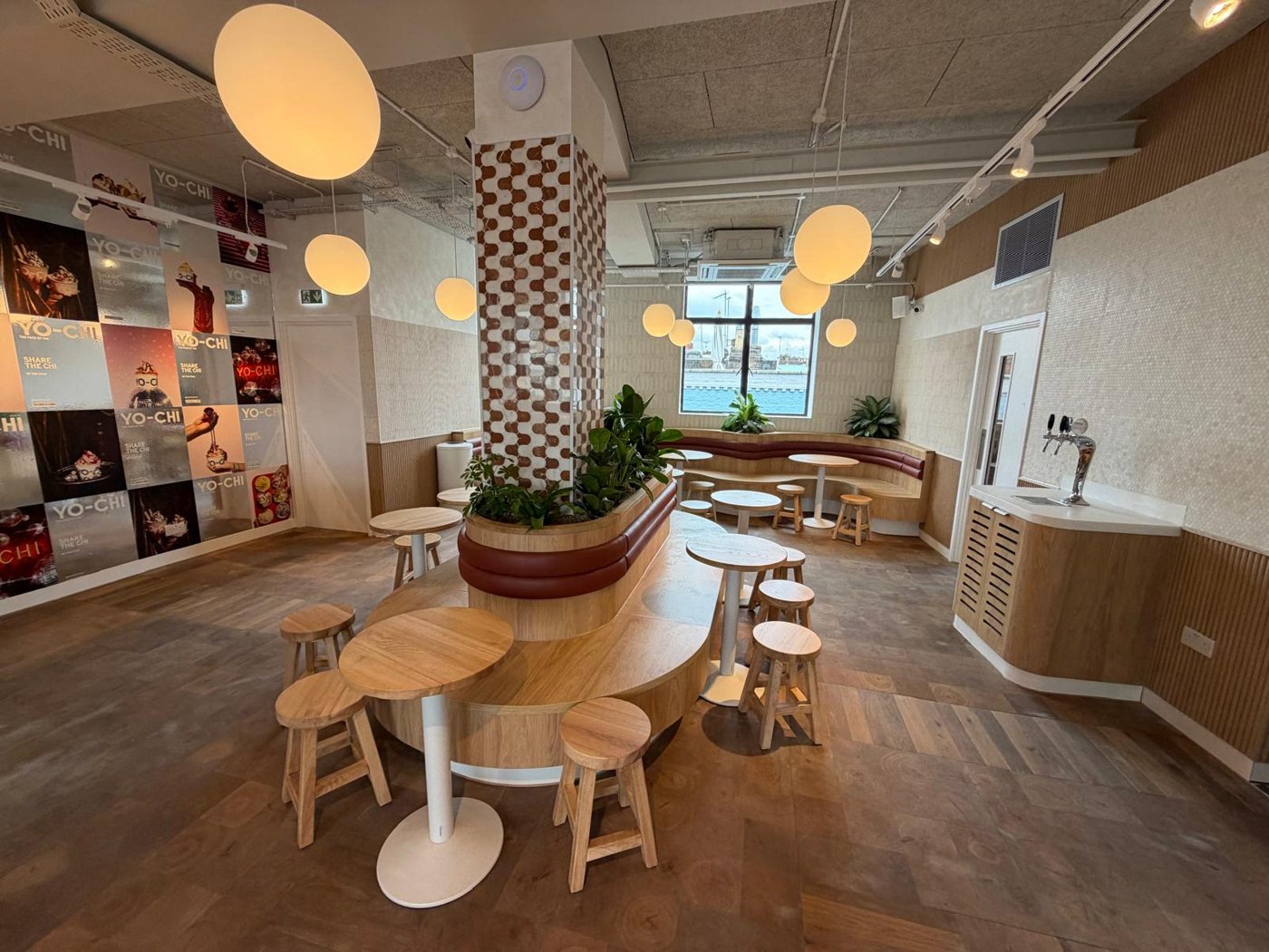 Yo-Chi — finished seating area with curved banquette joinery